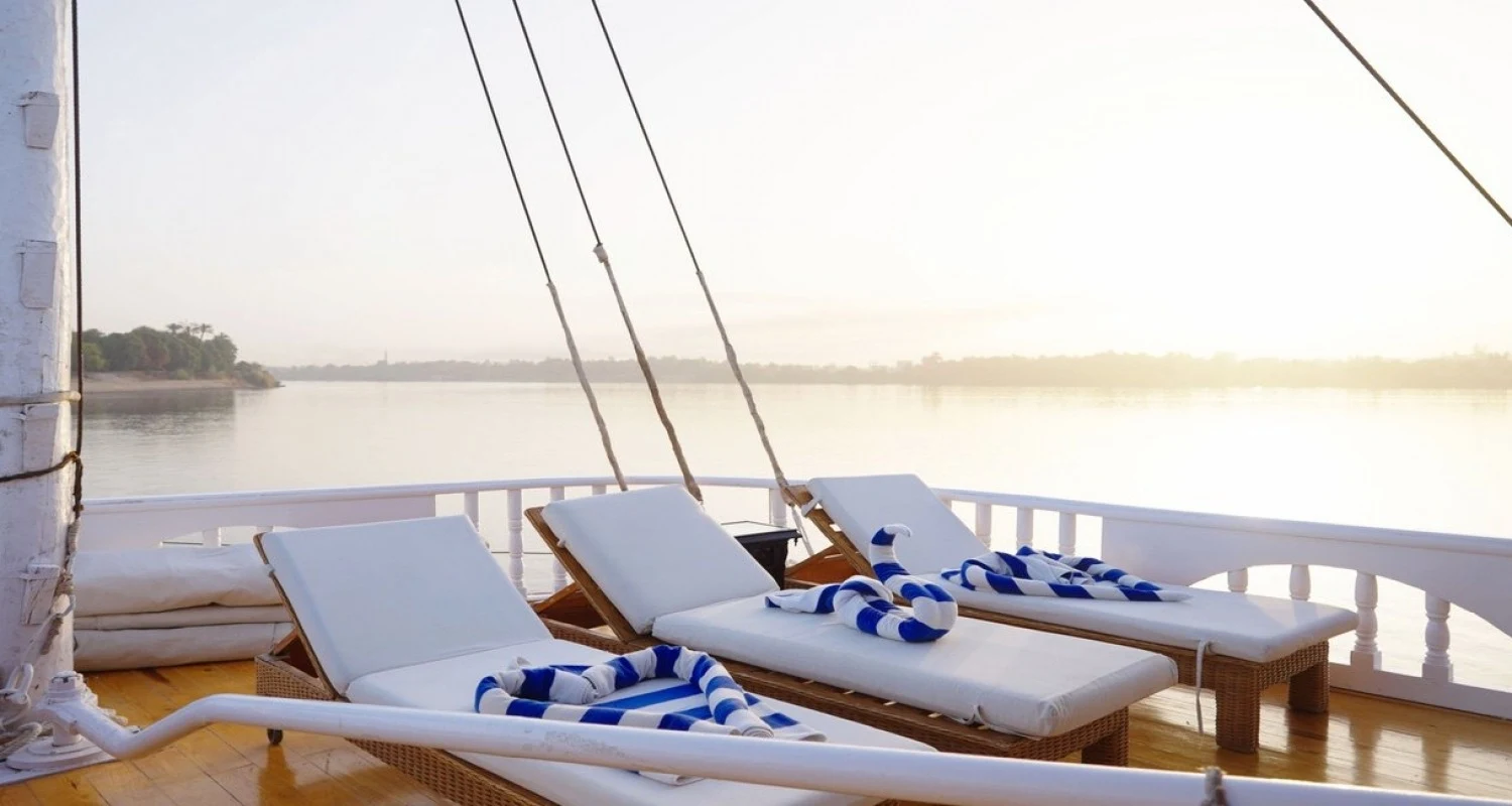 Quiet seating on a Nile boat deck overlooking the river